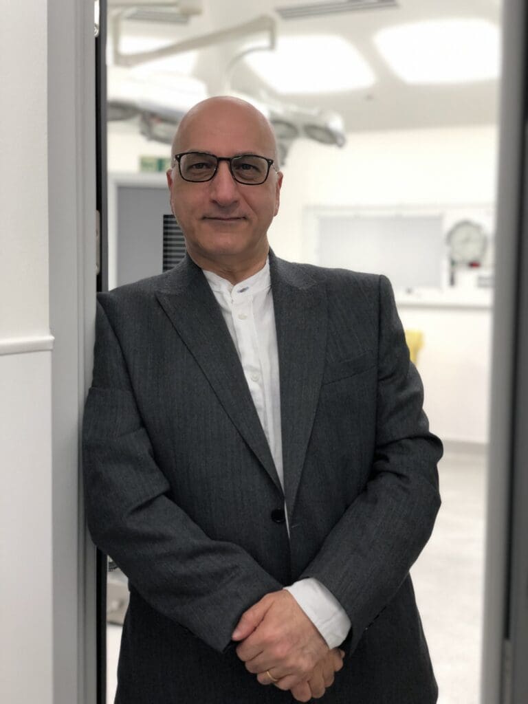 image showing Mr Ali Juma at his plastic surgery clinic